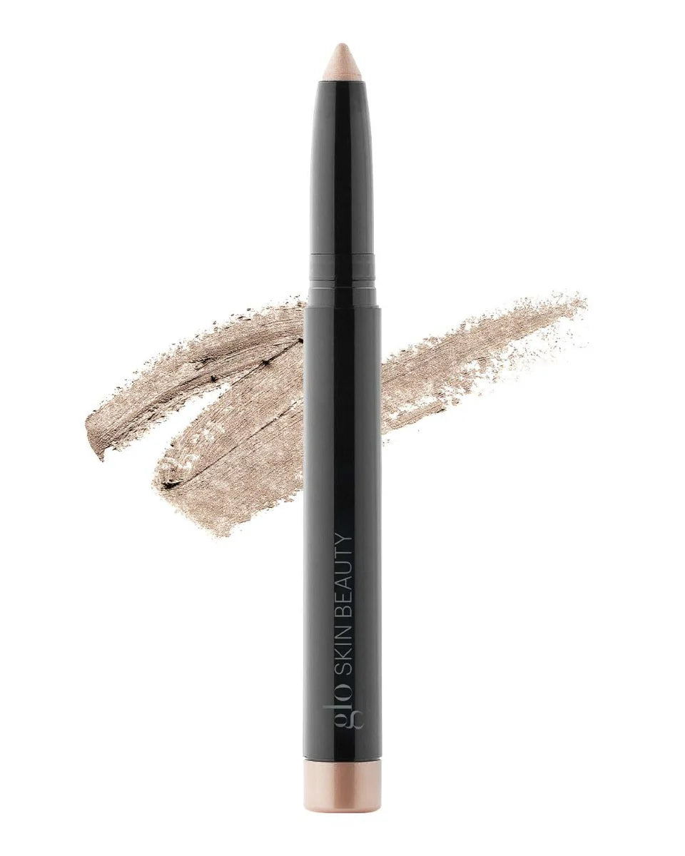 Cream Eyeshadow Stick im Farbton Beam mit Swatch im Hintergrund, gebrandet mit Glo Skin Beauty