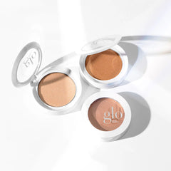 Glo Skin Beauty Skin Glow Powder Highlighter: Geöffnete & geschlossene Dosen in hellen & mittleren Nuancen