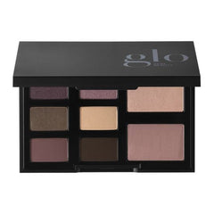 Schwarzes Kompakt, beschriftet mit Glo Skin Beauty, mit neun neutralen Lidschatten und zwei größeren Face-Pans, Farbton Moonstruck