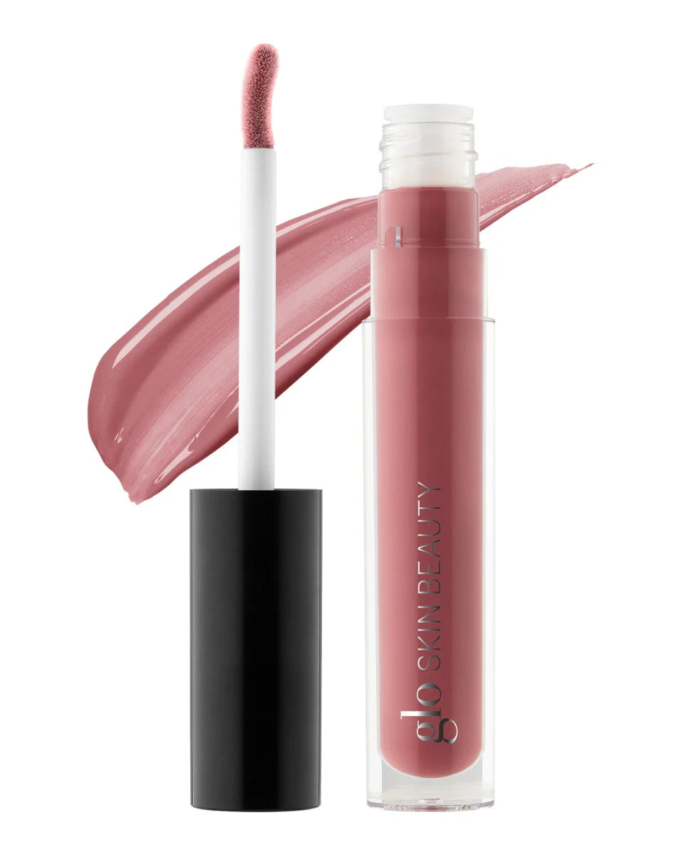 Glo Skin Beauty Desert Bloom Glitter Lipgloss mit Doe-Foot-Applikator und passendem Farb-Swatch.