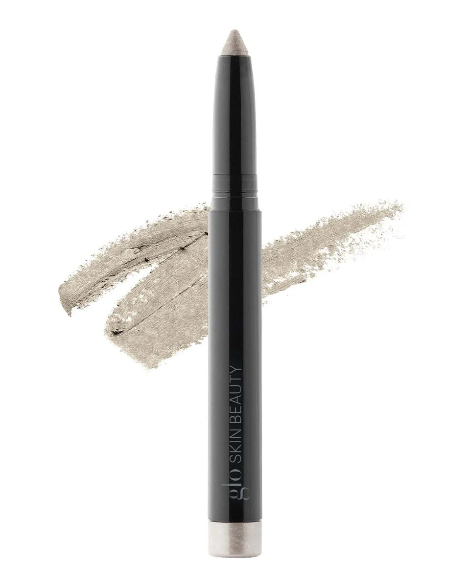 Cream Eyeshadow Stick im Farbton Halo mit Swatch im Hintergrund, gebrandet mit Glo Skin Beauty