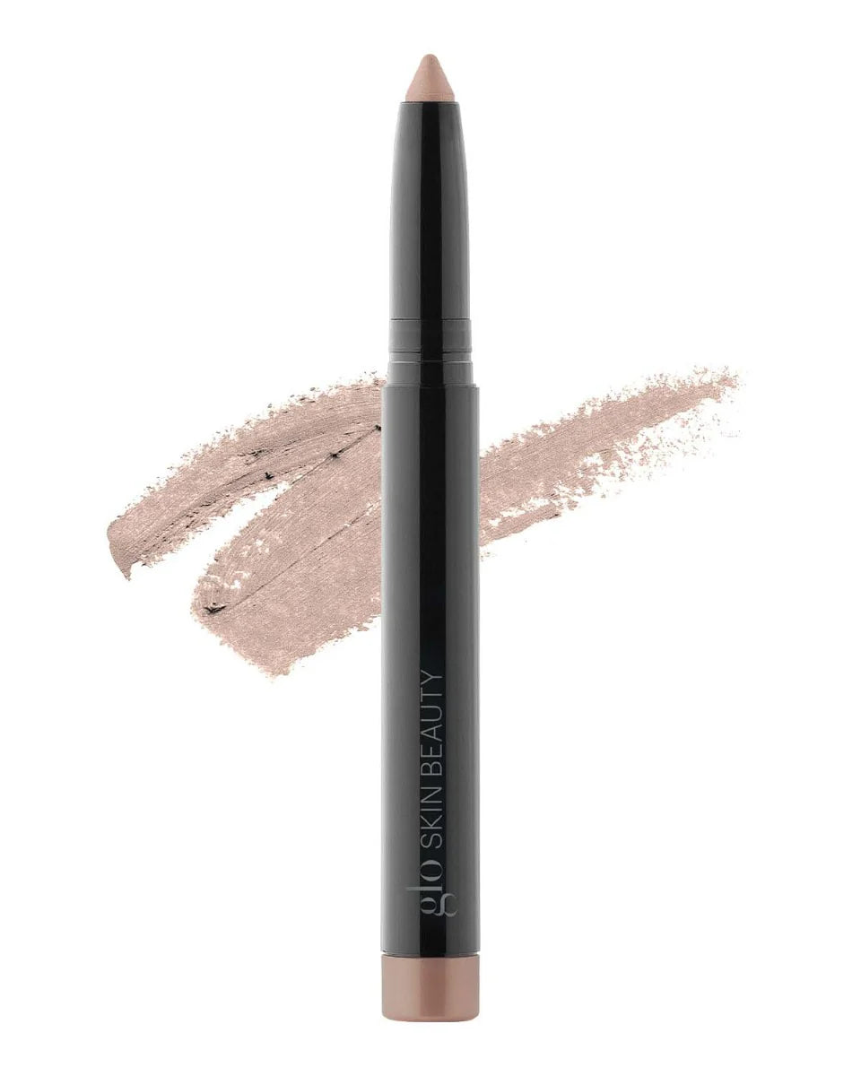 Cream Eyeshadow Stick im Farbton Shell mit Swatch im Hintergrund, gebrandet mit Glo Skin Beauty