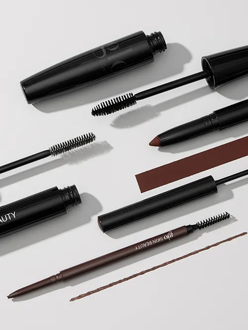 Glo Skin Beauty Augen-Make-up Kollektion: Mascara, Augenbrauenstift und Cream Stay Shadow Stick mit Textur-Swatches